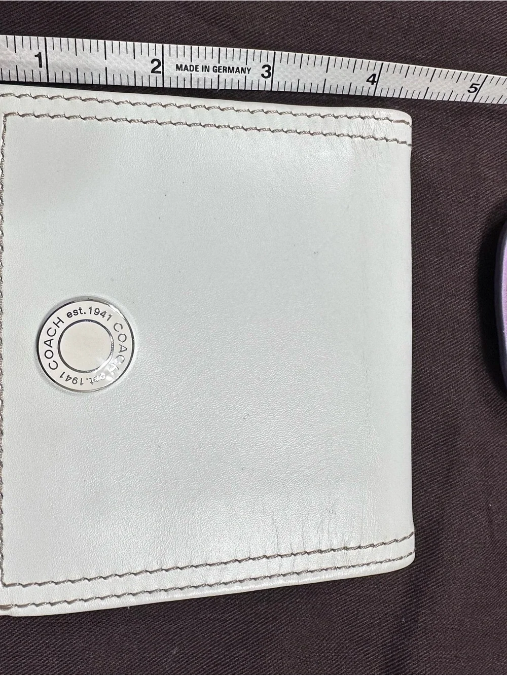 COACH White Leather Fold Wallet with Signature Metal Accent